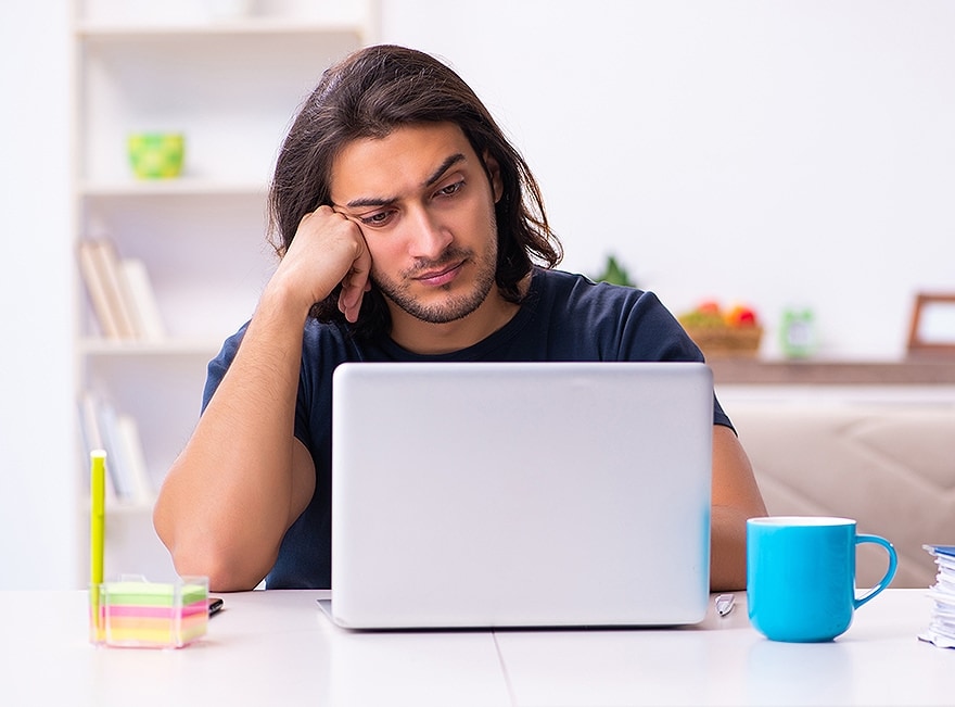 man sitting at his laptop