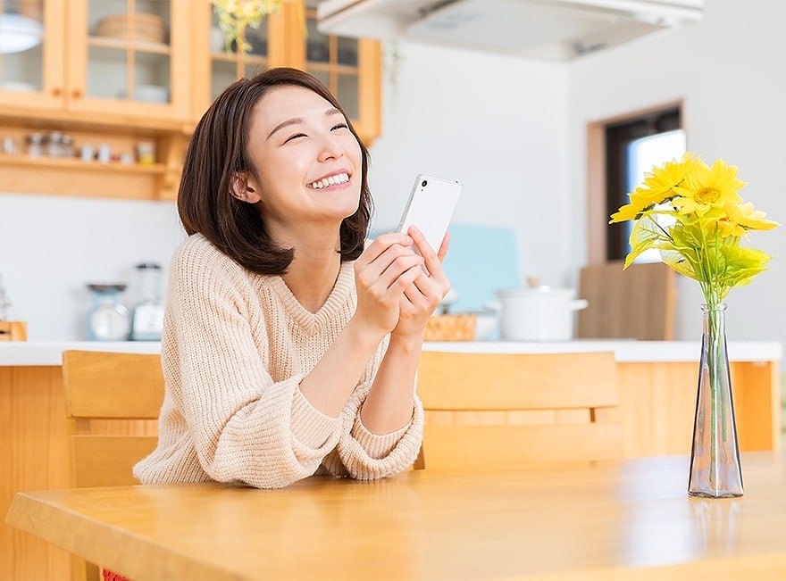 woman smiling at her table